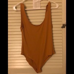 Mustard body suit with snaps